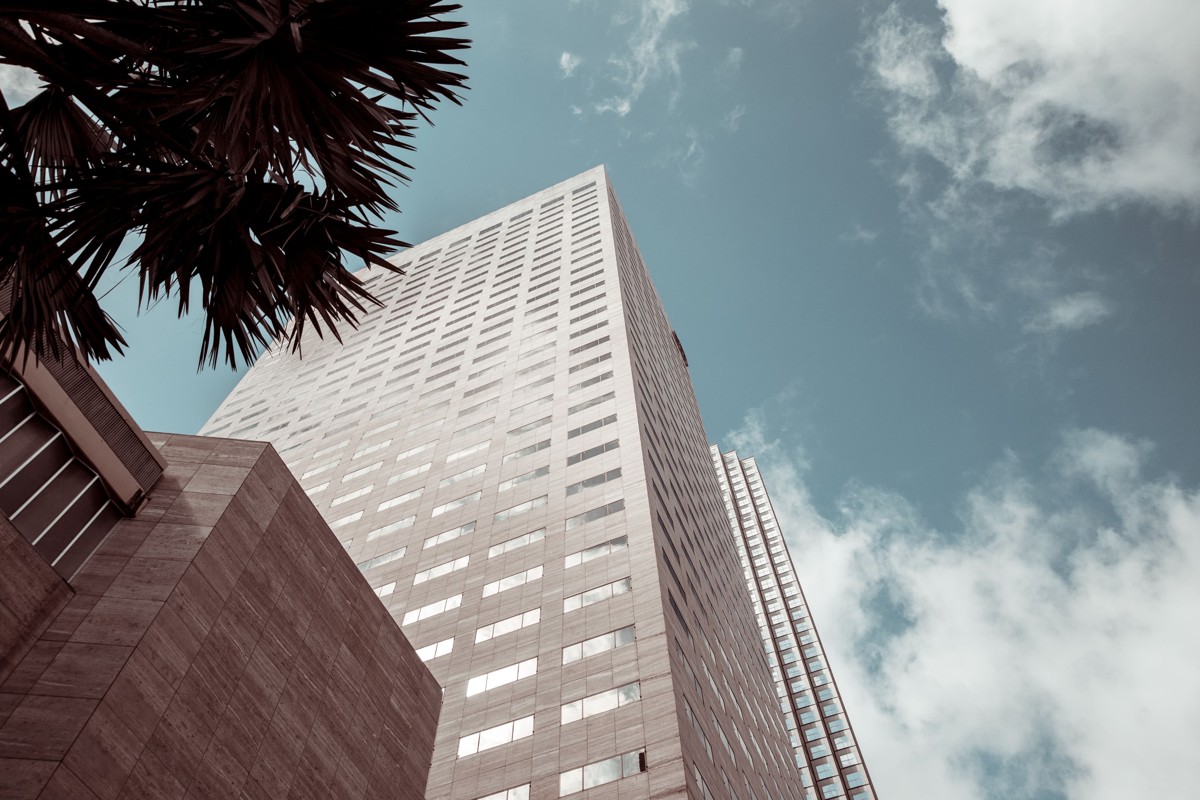 High-rise office tower seen from below against the sky